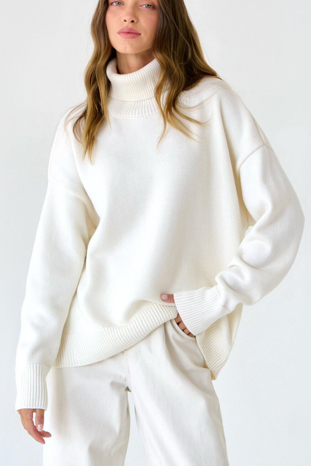 Pull femme col roulé oversize à ourlet asymétrique