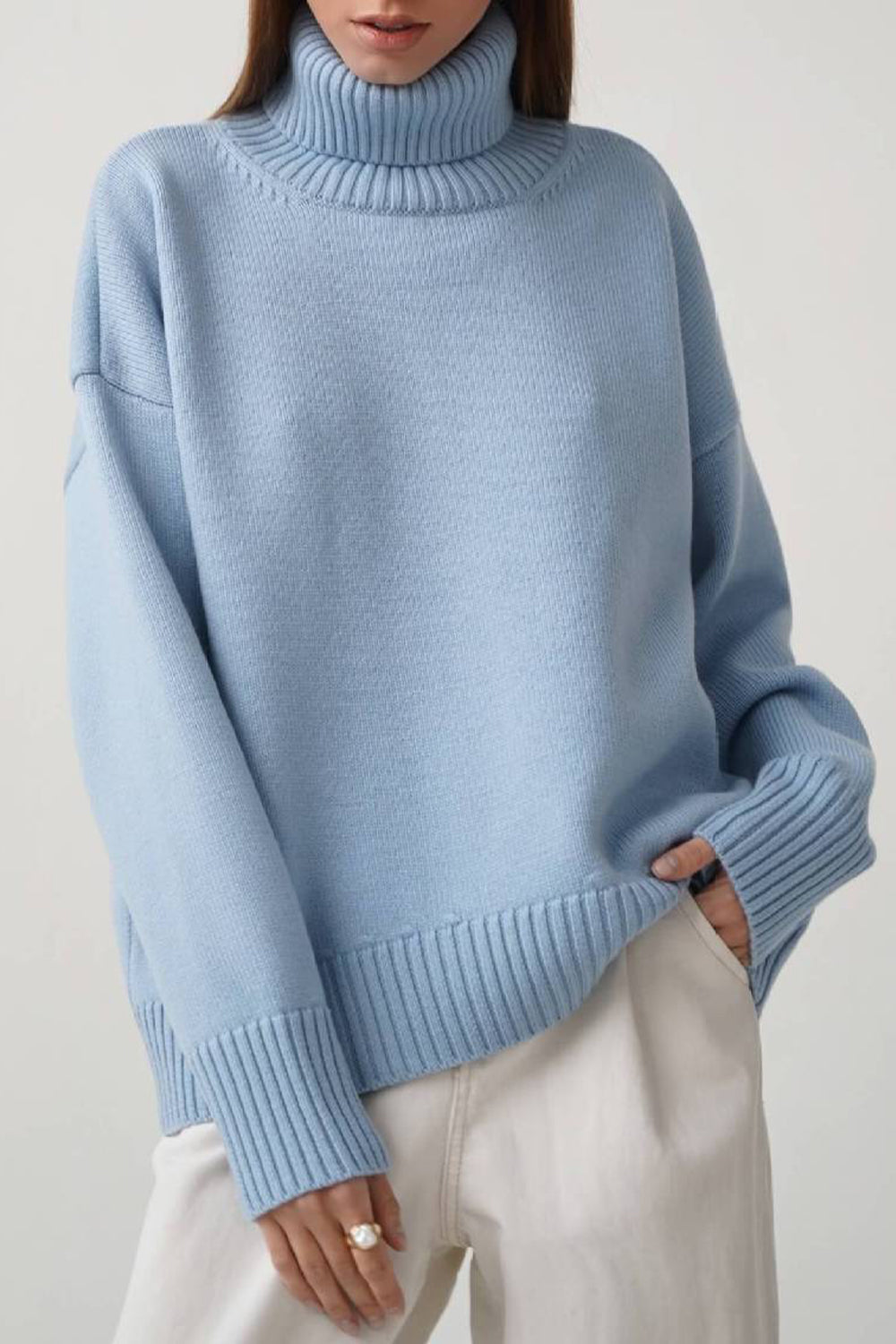 Pull femme col roulé oversize à ourlet asymétrique